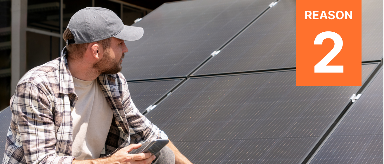 A homeowner gazes at his solar panels, evaluating the manufacturer warranty