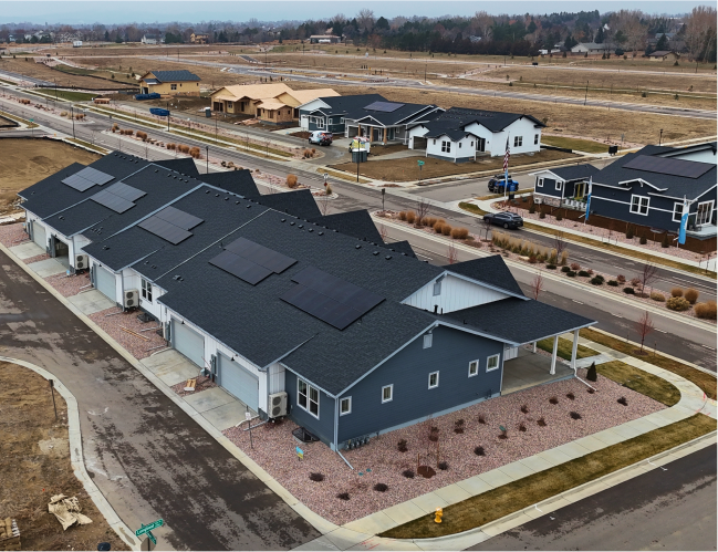 arial view of houses with solar panels 