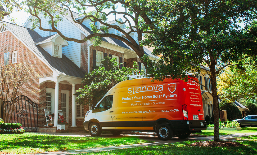 Sunnova services van parked in front of a brick house