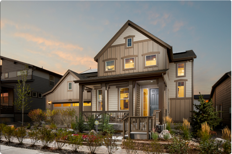 wooden house with plants in front