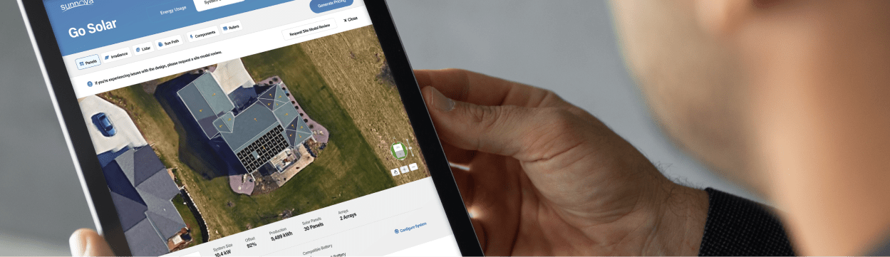 Customer reviewing the final solar panel design on his tablet.
