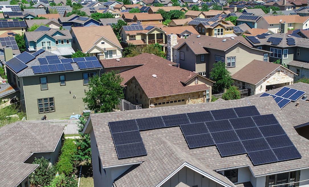 Neighborhood with solar panels on rooftops