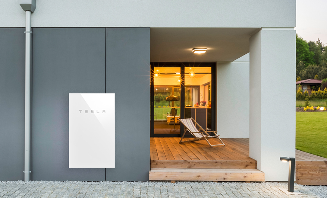 Tesla Battery mounted on back of house